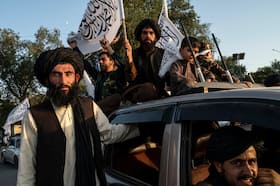 Members of the Taliban are seen in front of the former U.S. Embassy in Kabul on Aug. 14 as they celebrate the third anniversary of the Taliban's takeover of Afghanistan. (Wakil Kohsar/AFP/Getty Images)