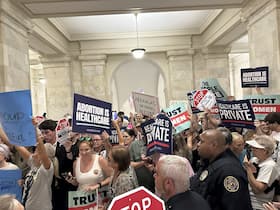 Supporters and opponents of a proposed ballot measure to scale back an Arkansas abortion ban in Little Rock on July 5. (Andrew DeMillo/AP)