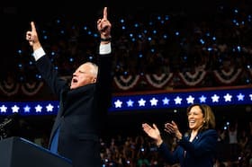 Minnesota Gov. Tim Walz celebrates after Vice President Kamala Harris announced he would be her running mate Tuesday in Philadelphia. (Demetrius Freeman/The Washington Post)