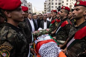 Palestinian security forces carry the body of Turkish American activist Aysenur Eygi during a memorial procession in the West Bank city of Nablus on Monday.