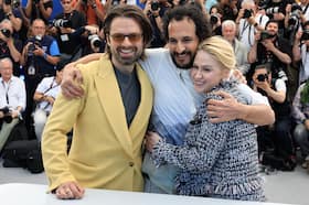 Sebastian Stan, Ali Abbasi and Maria Bakalova at the Cannes premiere of “The Apprentice.”