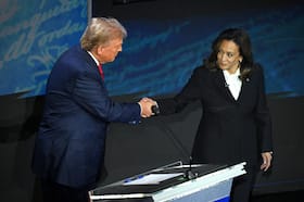 Vice President Kamala Harris shakes hands with former president Donald Trump before their debate in Philadelphia on Tuesday. (Saul Loeb/AFP/Getty Images)