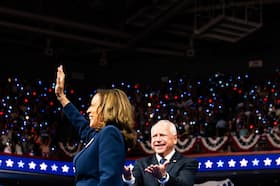 Vice President Kamala Harris and Gov. Tim Walz of Minnesota greet the crowd during a campaign event in Philadelphia on Tuesday. (Demetrius Freeman/The Washington Post)