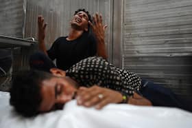 Palestinians mourn Monday over the body of a relative who was killed in an Israeli strike before their funeral in Khan Younis in the southern Gaza Strip.